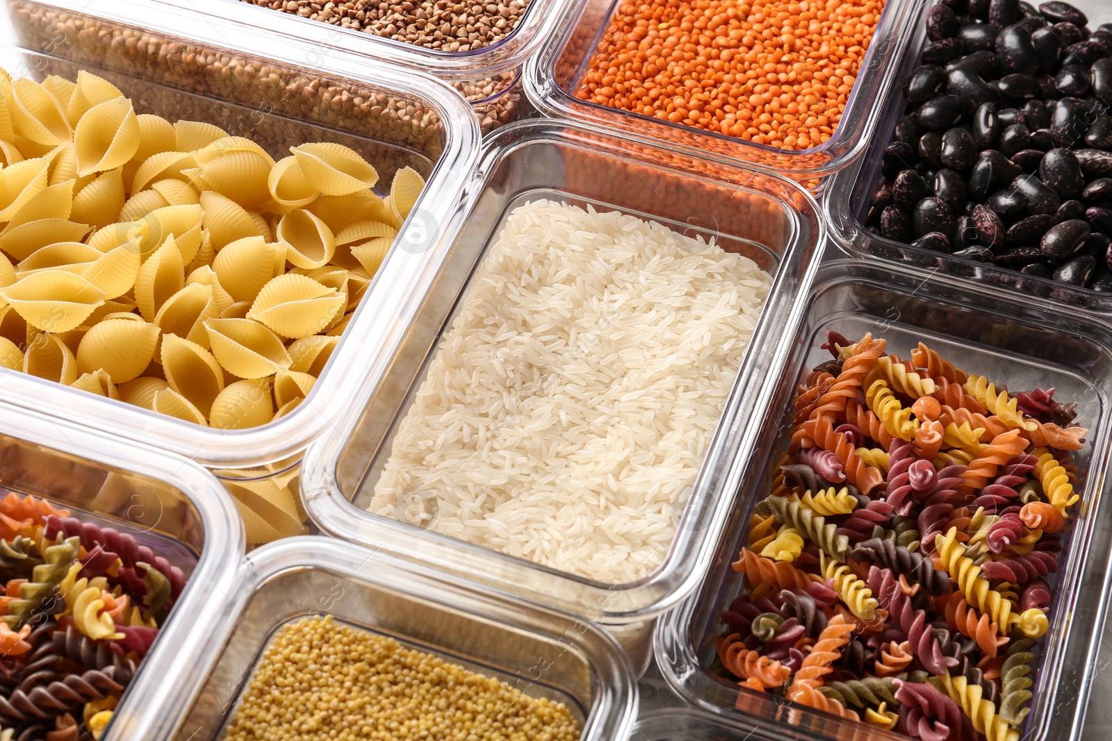 Photo of Many boxes with different raw food, closeup