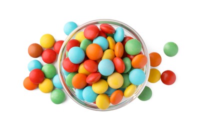 Bowl with colorful candies on white background, top view