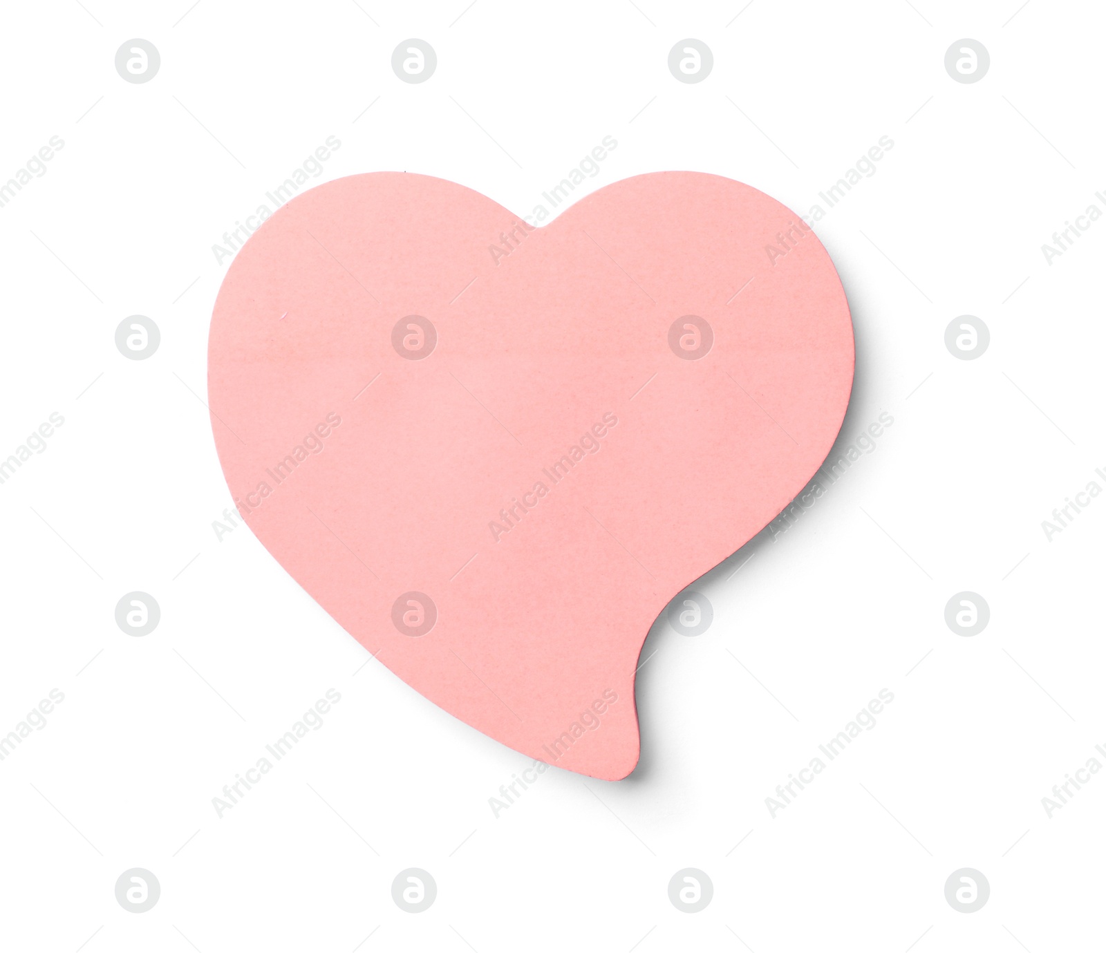 Photo of Heart shaped sticky note on white background. School stationery