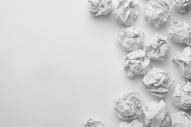 Crumpled sheets of paper on white background, top view