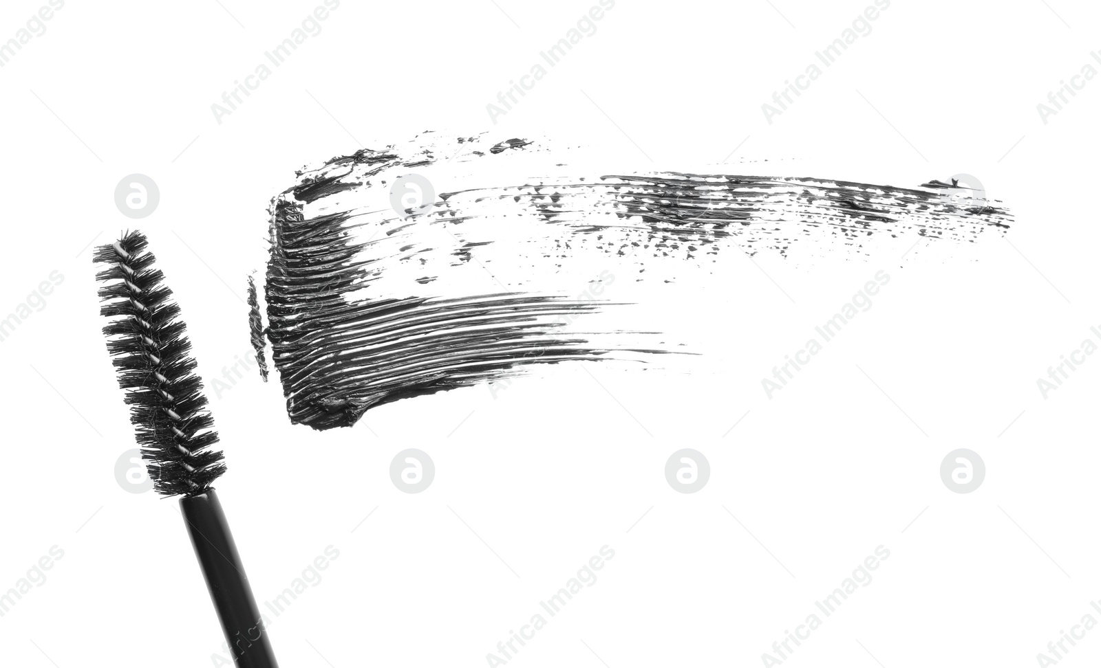 Photo of Smear of mascara and applicator isolated on white, top view