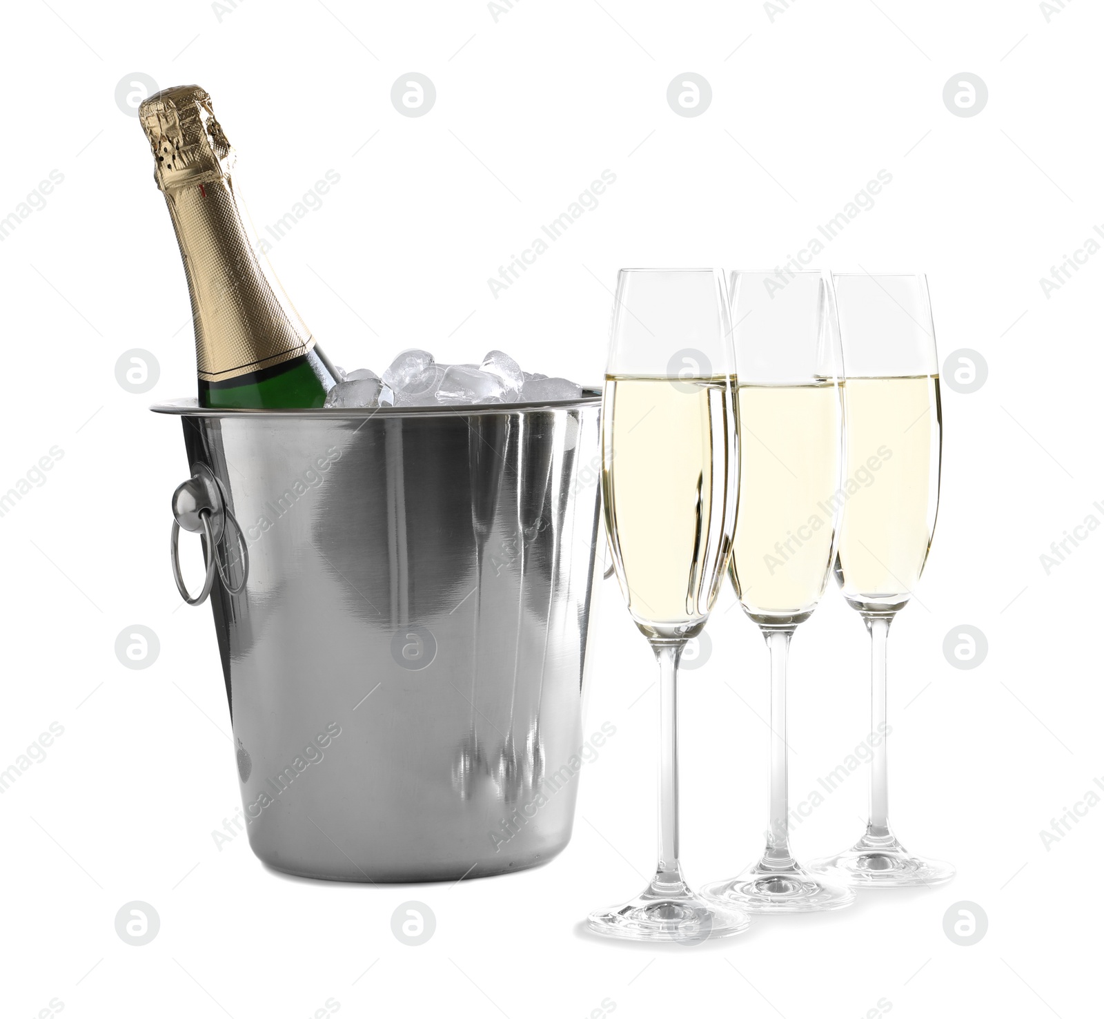 Photo of Glasses with champagne and bottle in bucket on white background