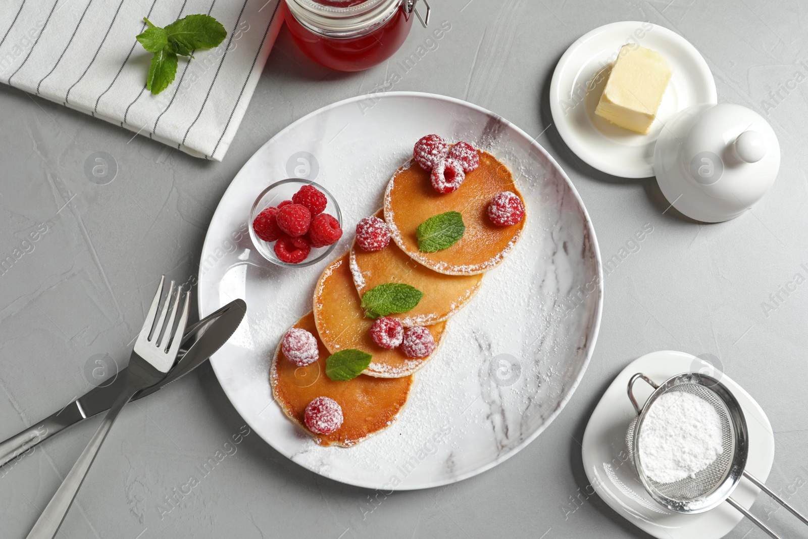 Photo of Flat lay composition with tasty pancakes and berries on table