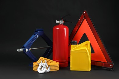 Photo of Set of car safety equipment on black background