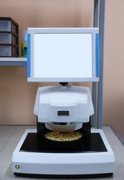 Photo of Multipurpose infrared analyzer for grain samples in modern laboratory