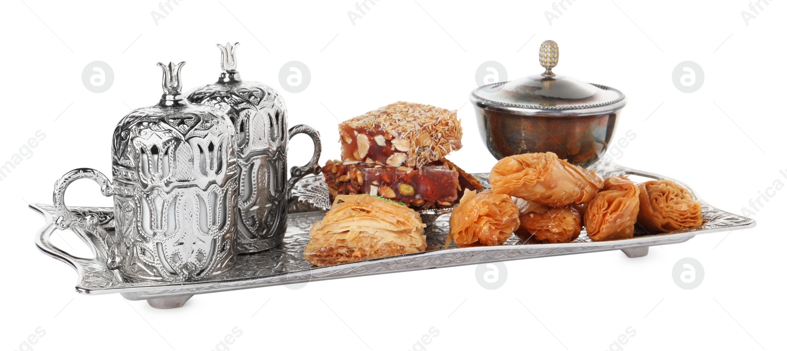 Photo of Tea, baklava dessert and Turkish delight served in vintage tea set on white background