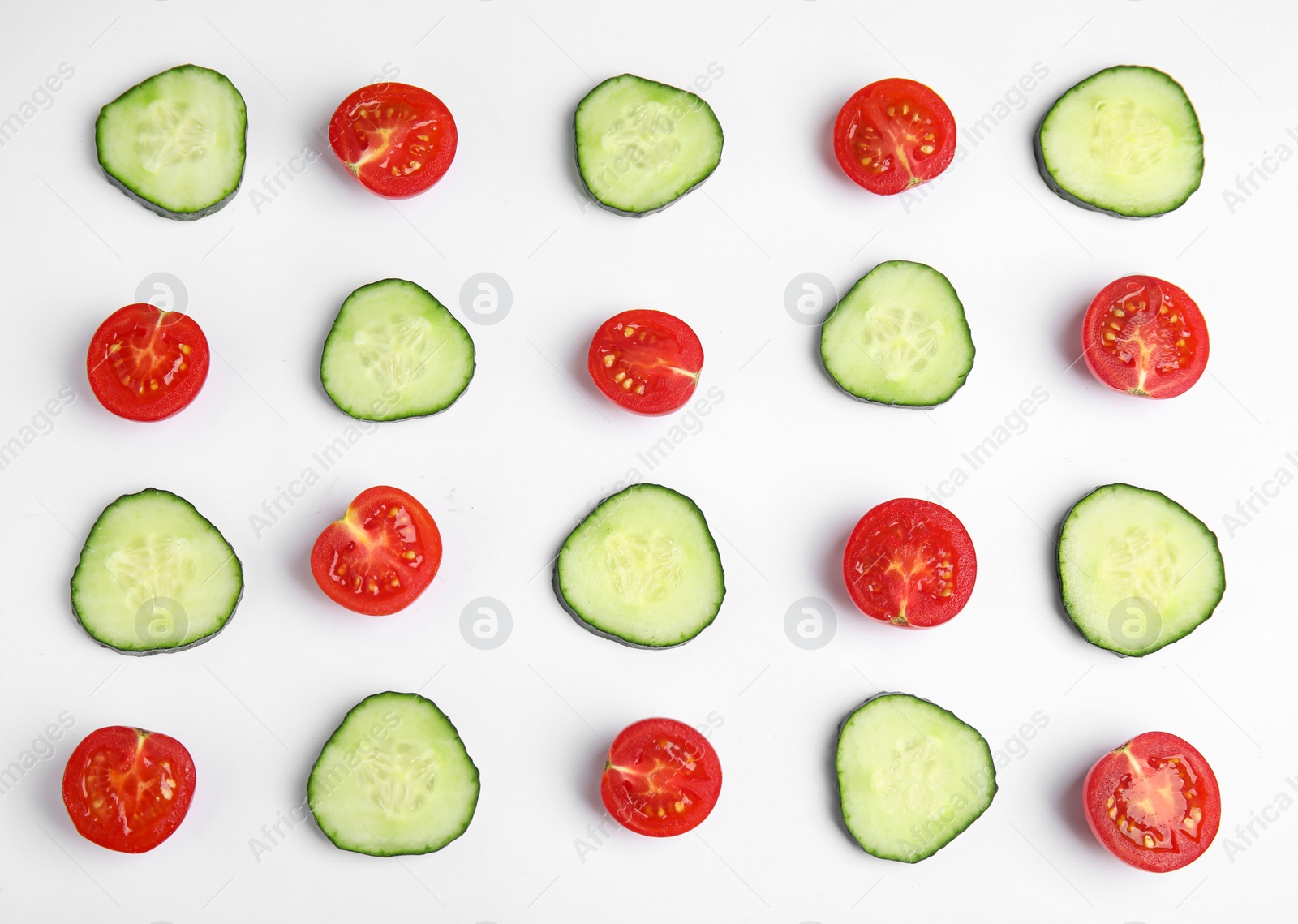 Photo of Fresh vegetables for salad on white background, top view