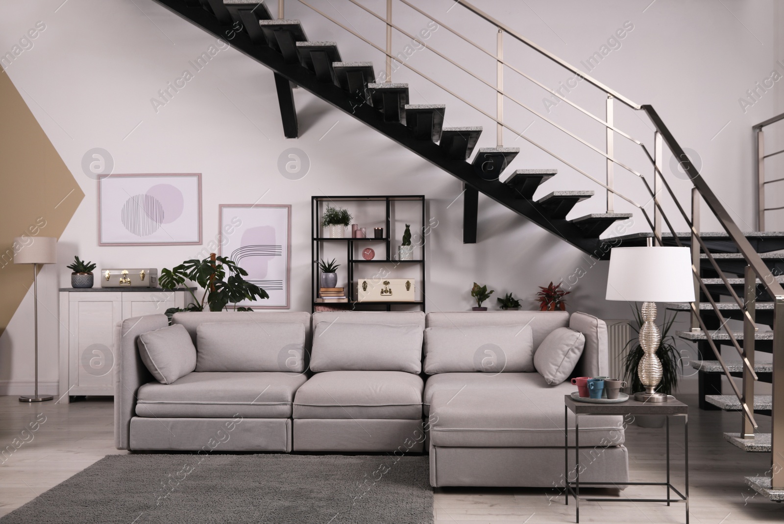 Photo of Stylish living room interior with comfortable sofa