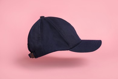 Baseball cap on pink background. Mock up for design