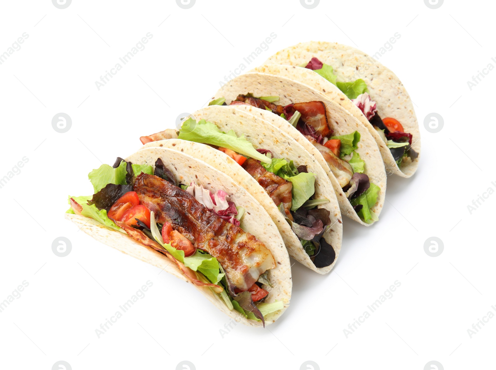 Photo of Delicious tacos with fried bacon and tomatoes on white background