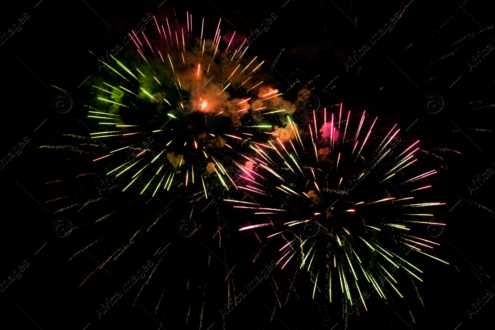 Image of Beautiful bright fireworks lighting up night sky