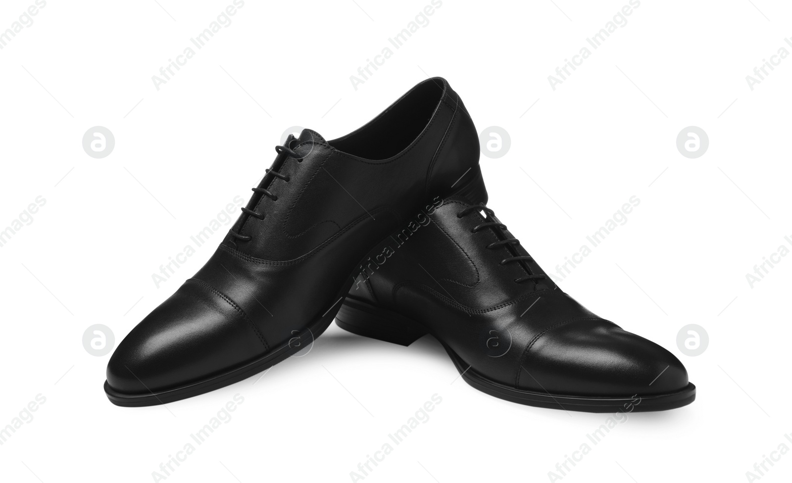 Photo of Pair of black leather men shoes isolated on white