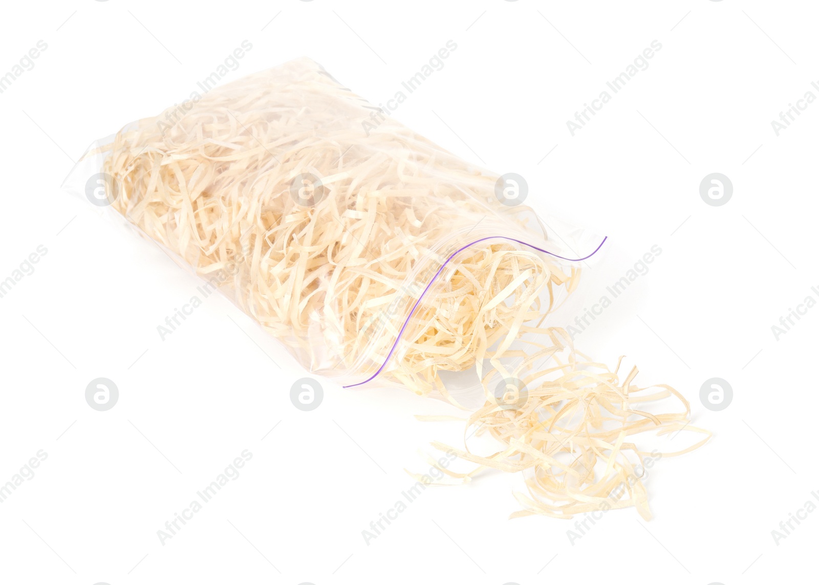 Photo of Wood shavings in zip bag isolated on white