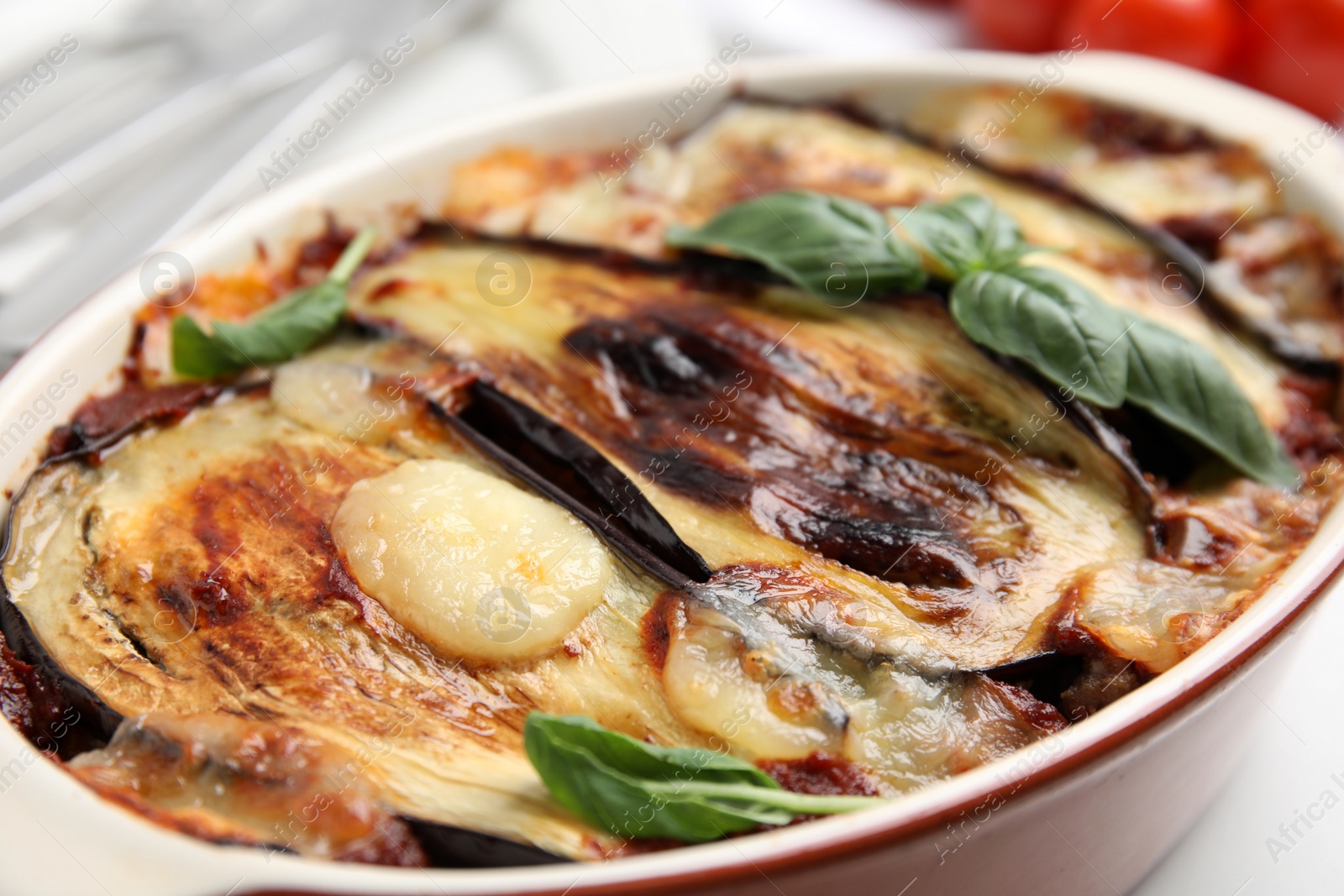 Photo of Delicious eggplant lasagna in baking dish, closeup