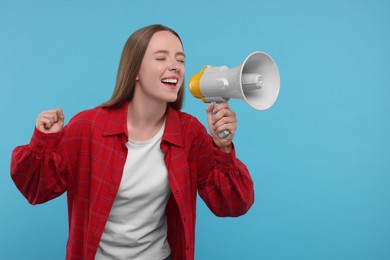 Photo of Emotional sports fan with megaphone on light blue background. Space for text