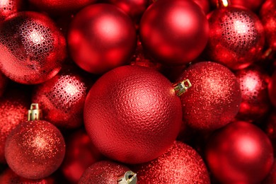 Red Christmas balls as background, top view