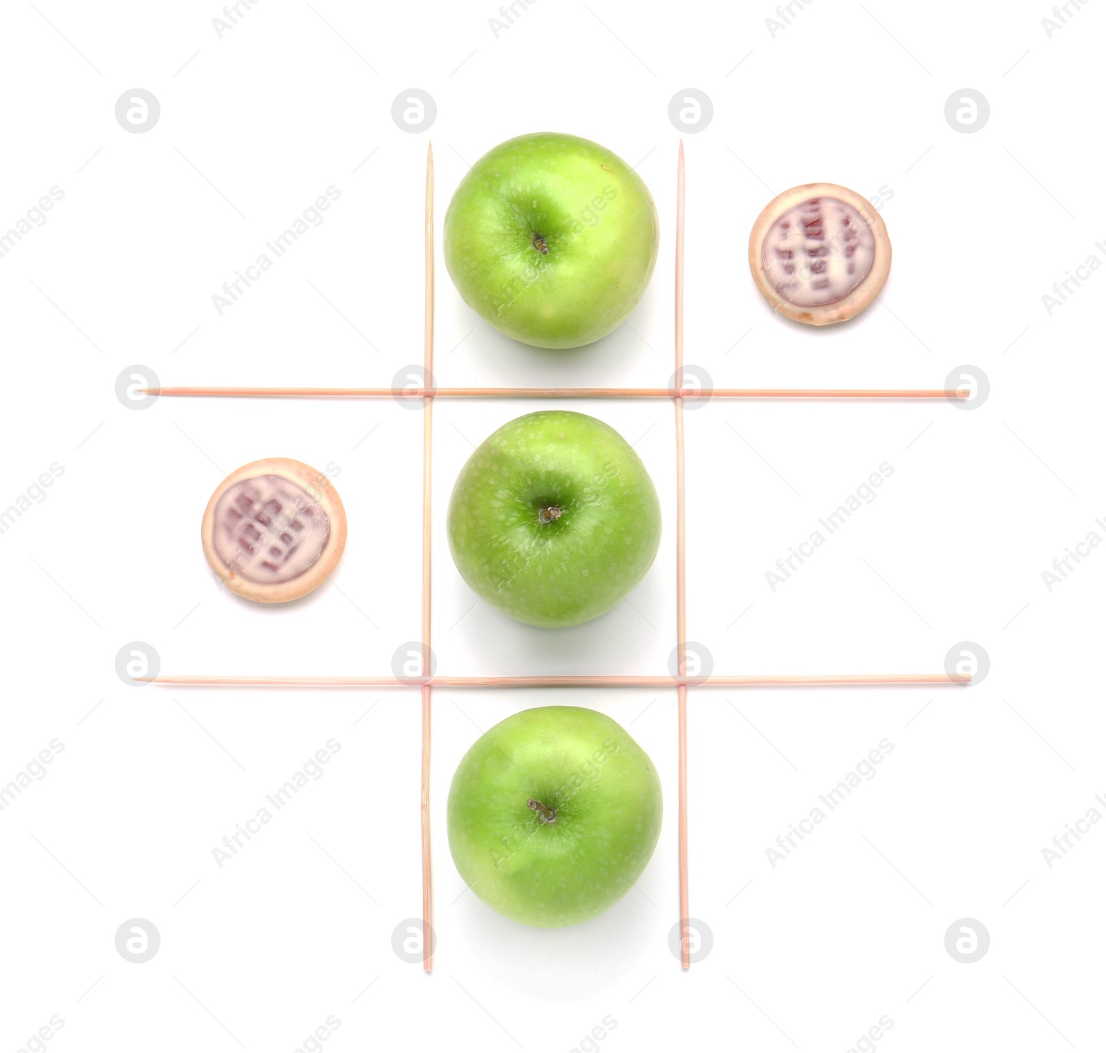 Photo of Tic tac toe game made with apples and cookies isolated on white, top view
