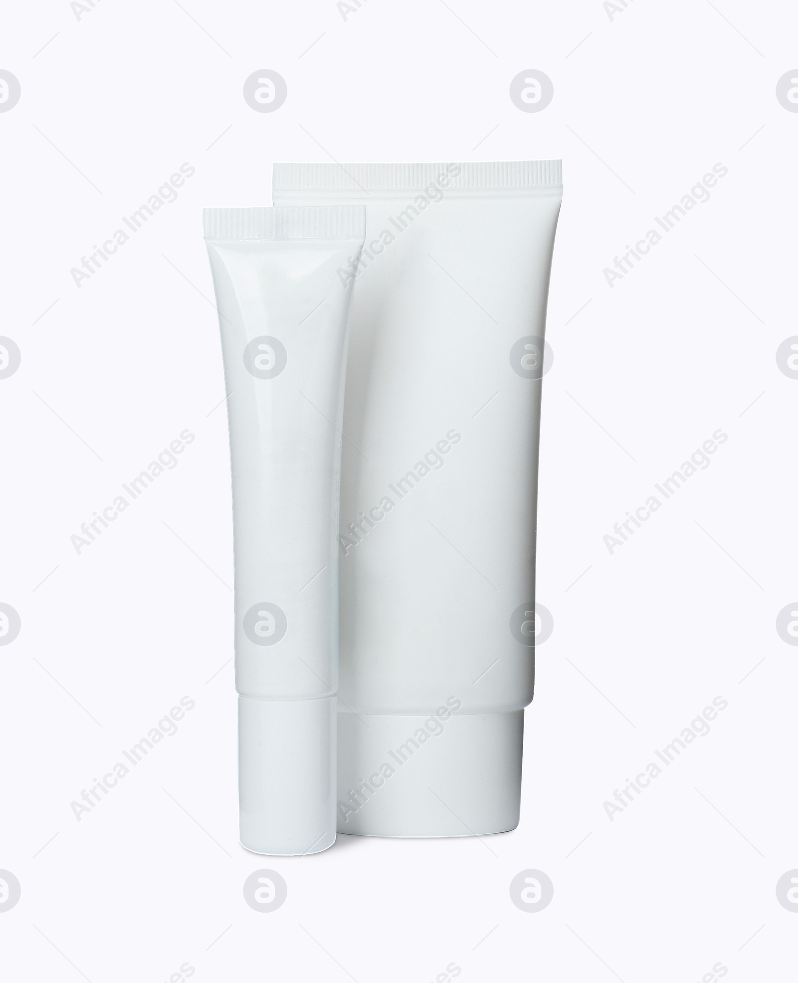 Photo of Tubes of different hand creams on white background. Mockup for design