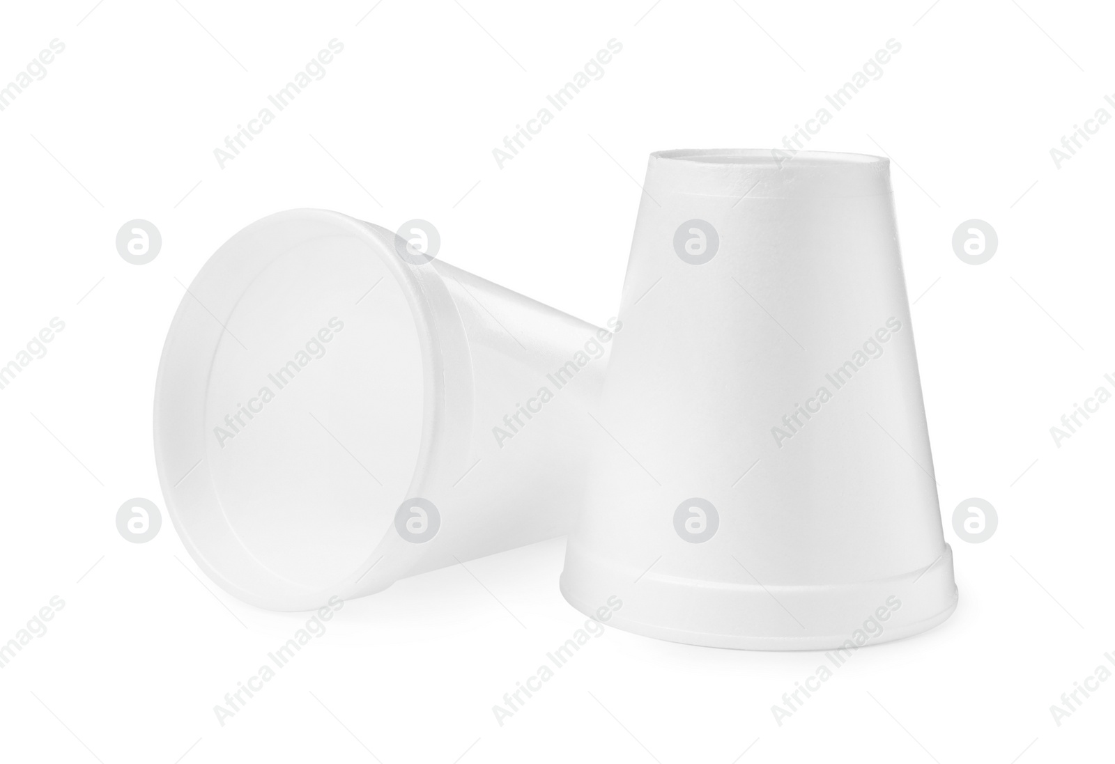 Photo of Two clean styrofoam cups on white background