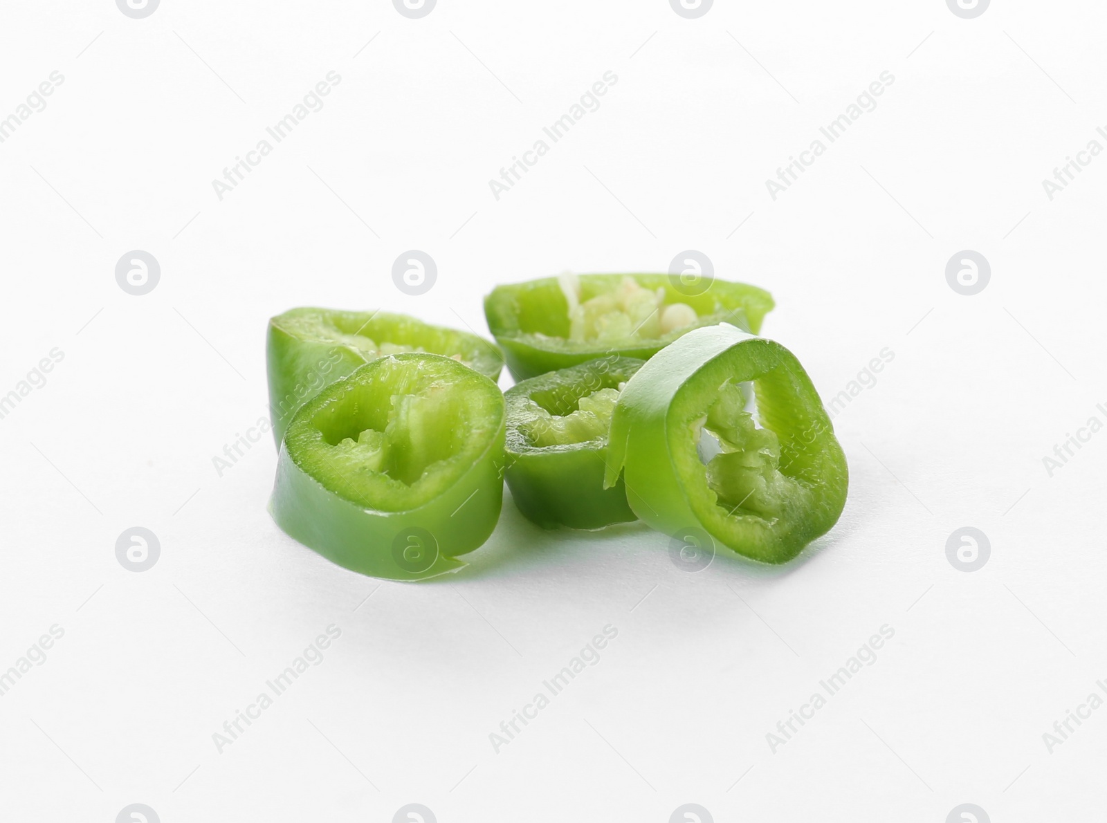 Photo of Cut ripe chili pepper on white background