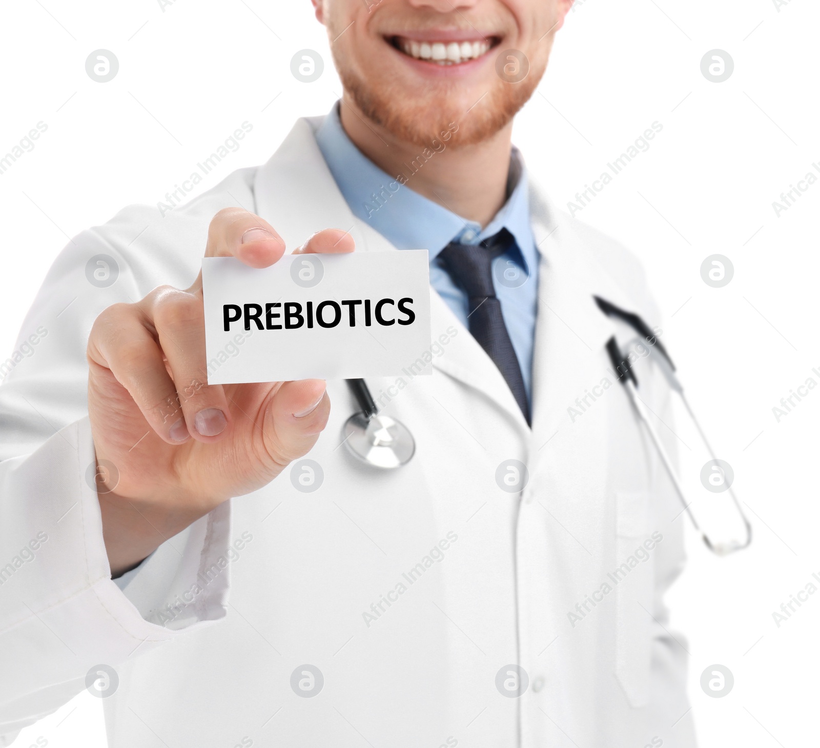 Image of Doctor holding card with word PREBIOTICS on white background, closeup