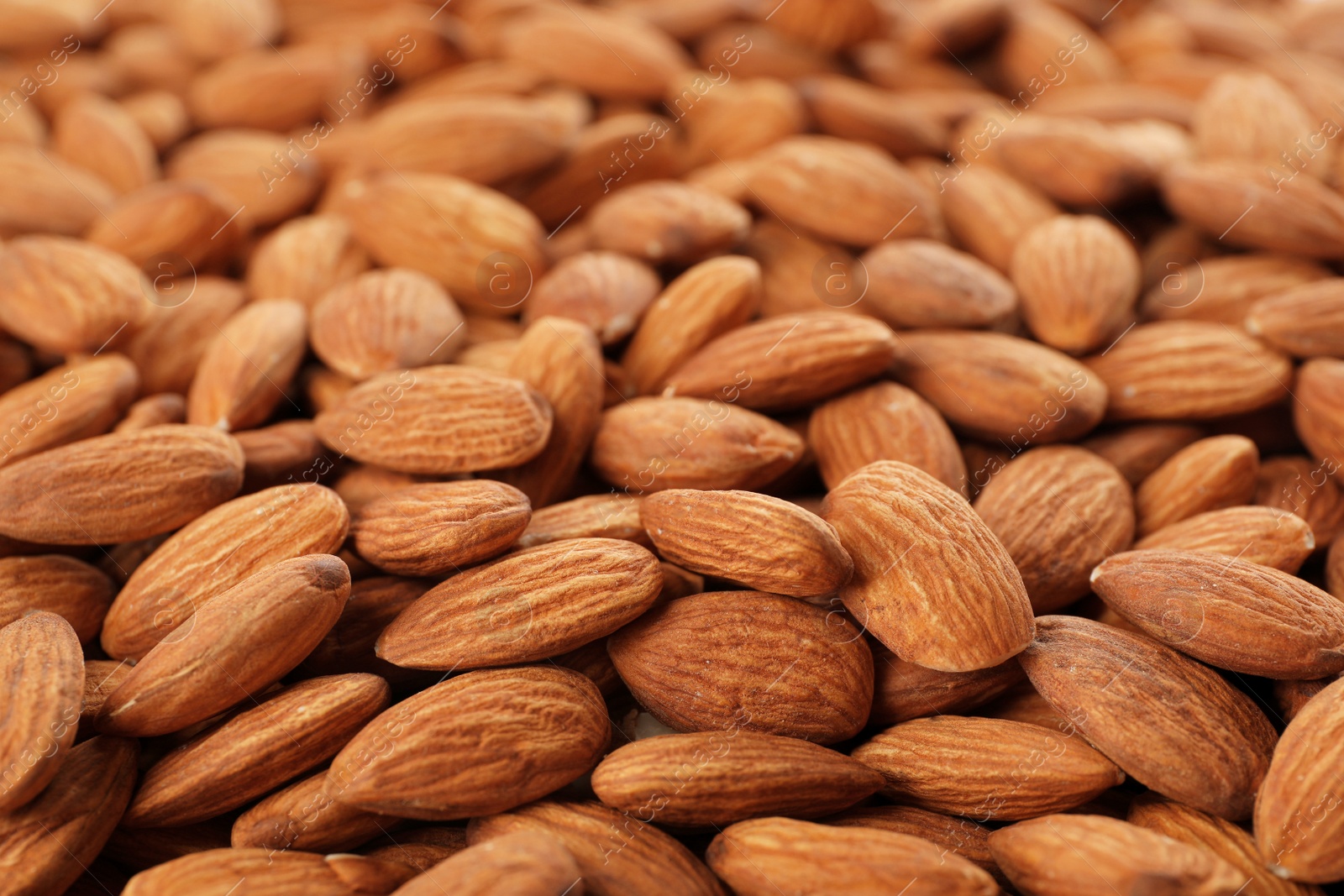 Photo of Organic almond nuts as background. Healthy snack