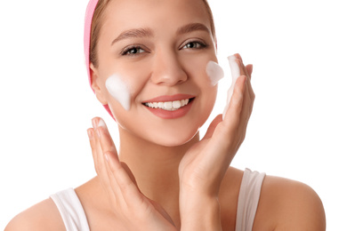 Photo of Young woman washing face with cleansing foam on white background. Cosmetic product