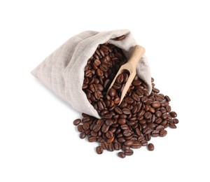 Bag and wooden scoop with roasted coffee beans isolated on white
