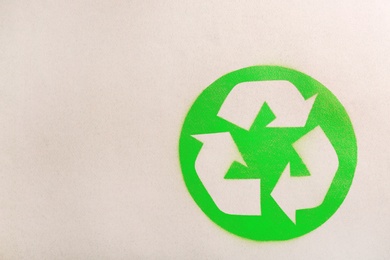 Recycling symbol on cardboard paper, top view with space for text
