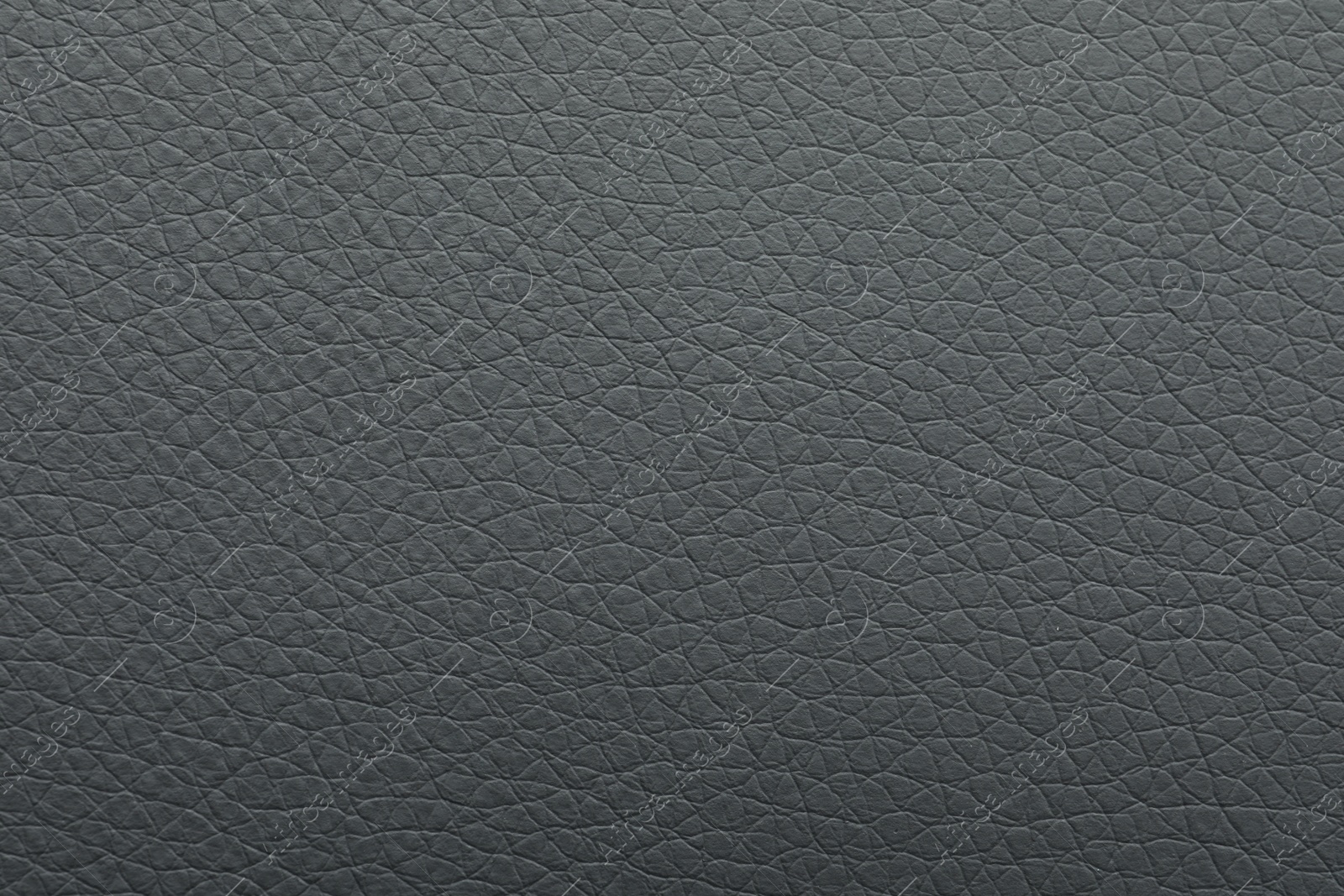 Photo of Texture of grey leather as background, closeup