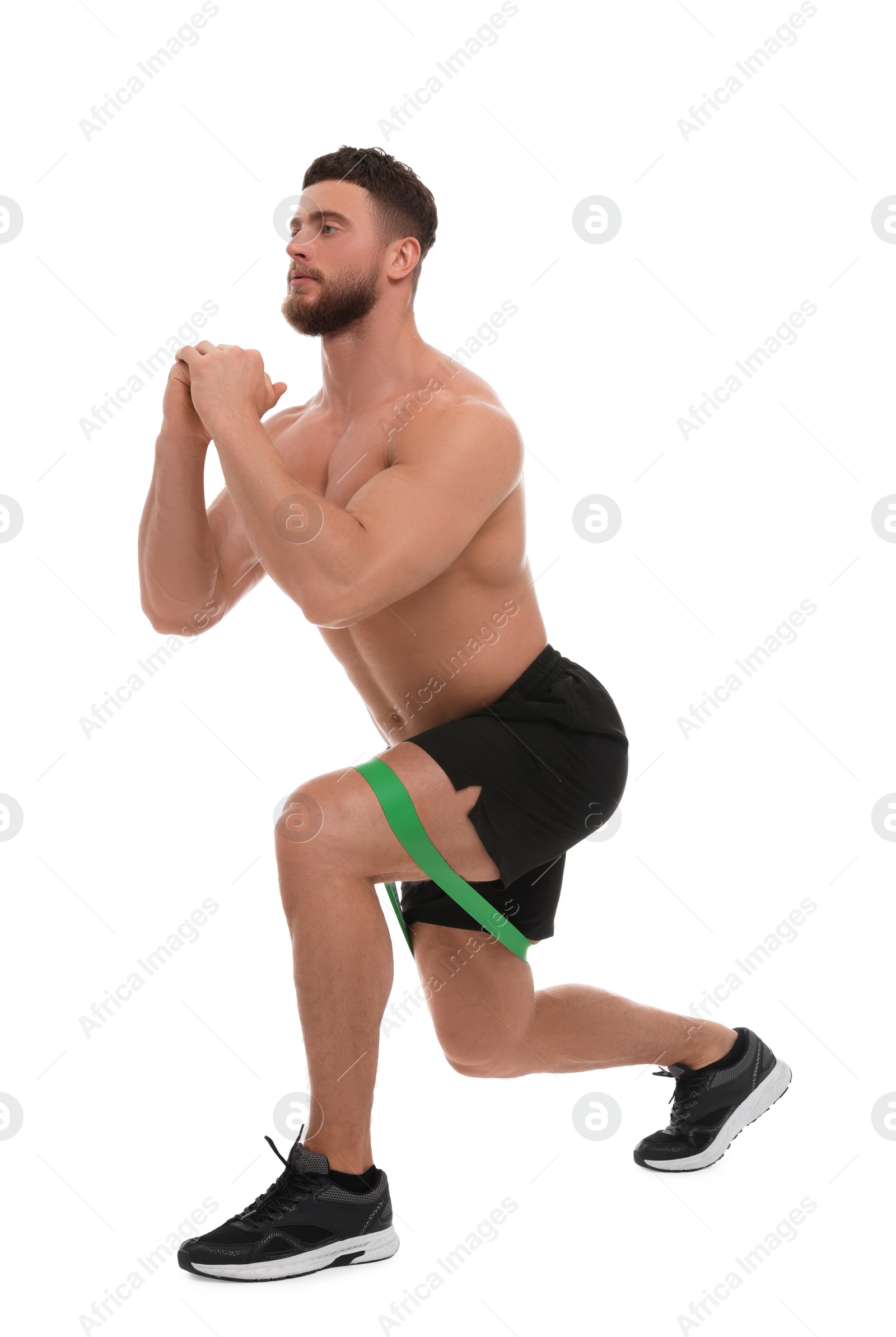 Photo of Young man exercising with elastic resistance band on white background