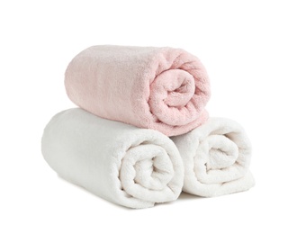 Rolled soft terry towels on white background