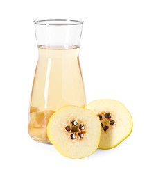 Photo of Tasty quince drink in glass carafe and fresh cut fruit isolated on white