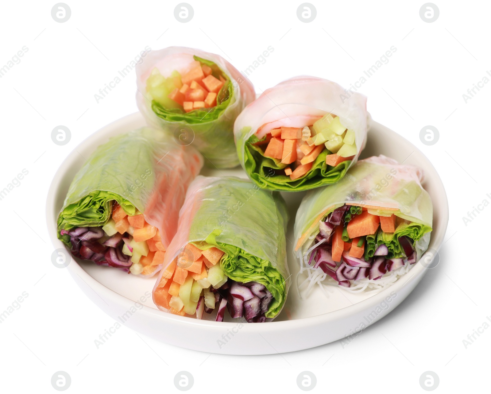 Photo of Plate of different delicious spring rolls wrapped in rice paper isolated on white