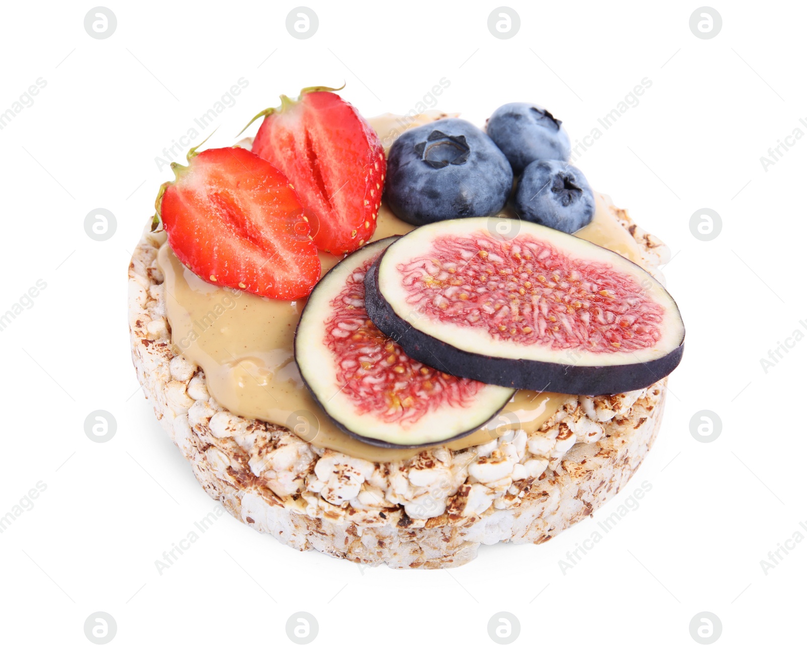 Photo of Tasty crispbread with peanut butter, berries and figs on white background