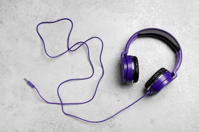 Photo of Stylish headphones on grey background, top view