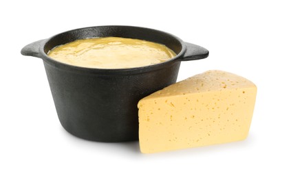 Fondue with tasty melted cheese and piece isolated on white