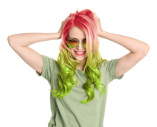 Image of Portrait of young woman with dyed long curly hair on white background