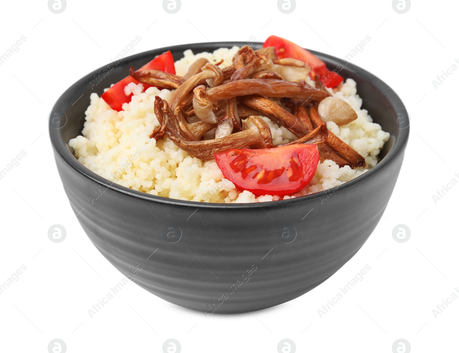 Photo of Bowl of tasty couscous with mushrooms and tomatoes on white background