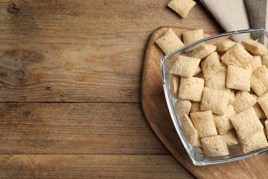 Photo of Delicious corn pads on wooden table, flat lay. Space for text