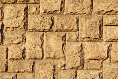 Texture of beautiful light brown stone wall as background