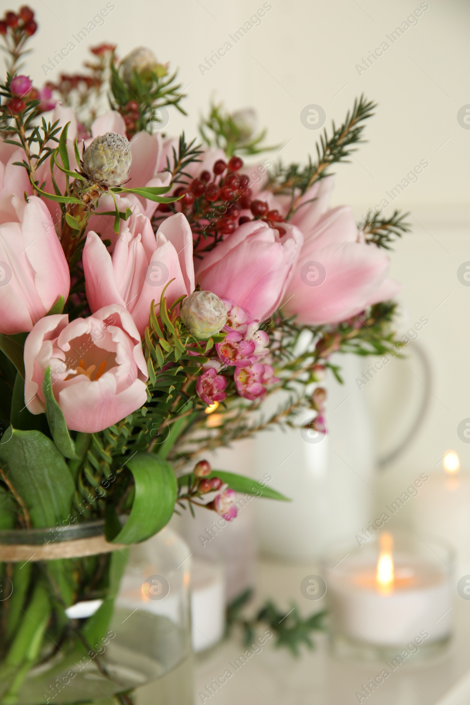 Photo of Beautiful bouquet with spring pink tulips on light background