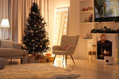 Photo of Beautiful Christmas tree and festive decor in living room