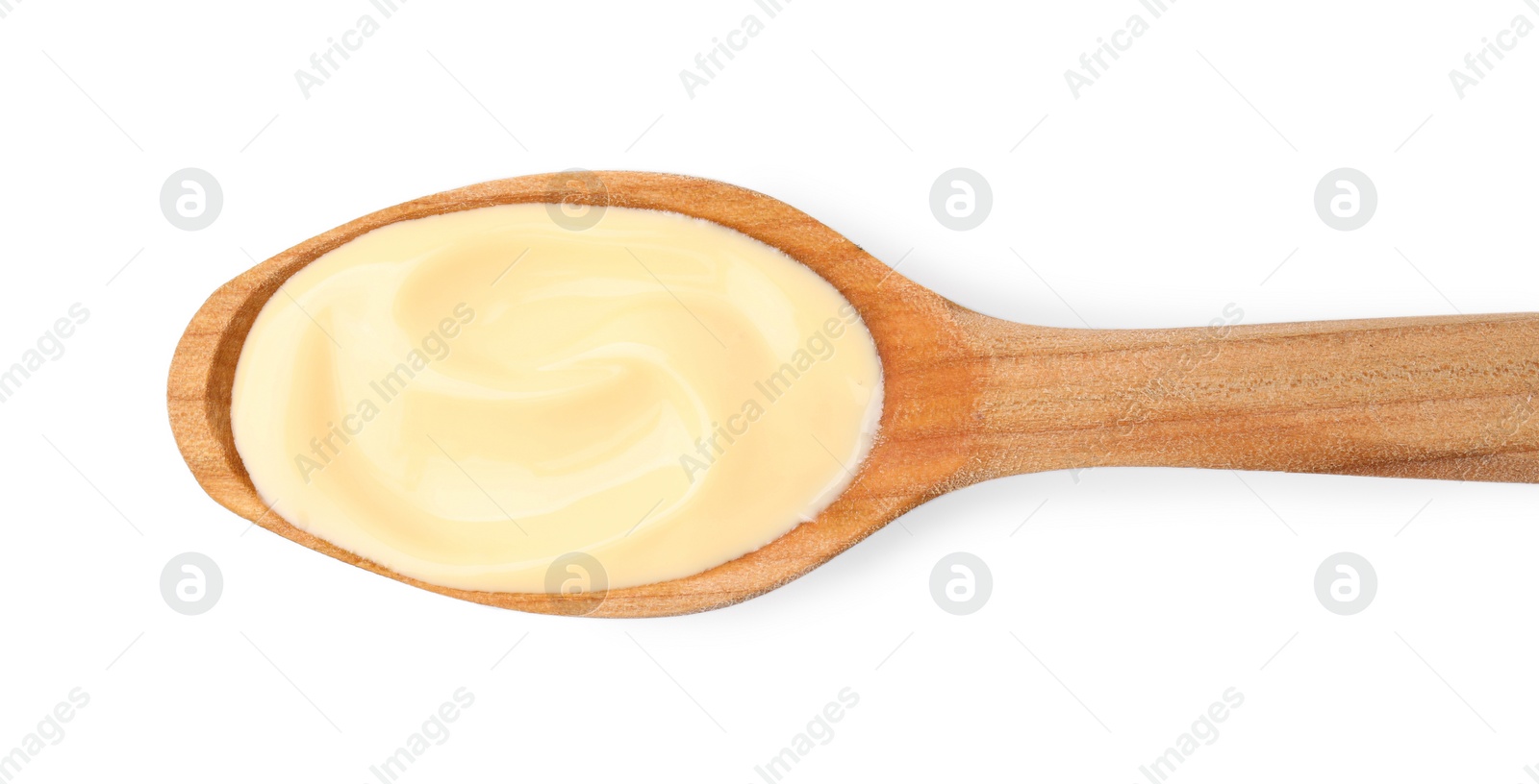 Photo of Wooden spoon with delicious cheese sauce isolated on white, top view