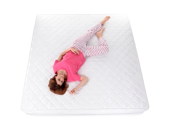 Woman sleeping on mattress against white background, above view