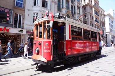 ISTANBUL, TURKEY - AUGUST 10, 2019: Old tram and people on city street