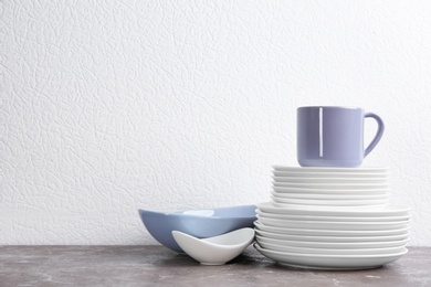 Photo of Set of new ceramic dishware on table