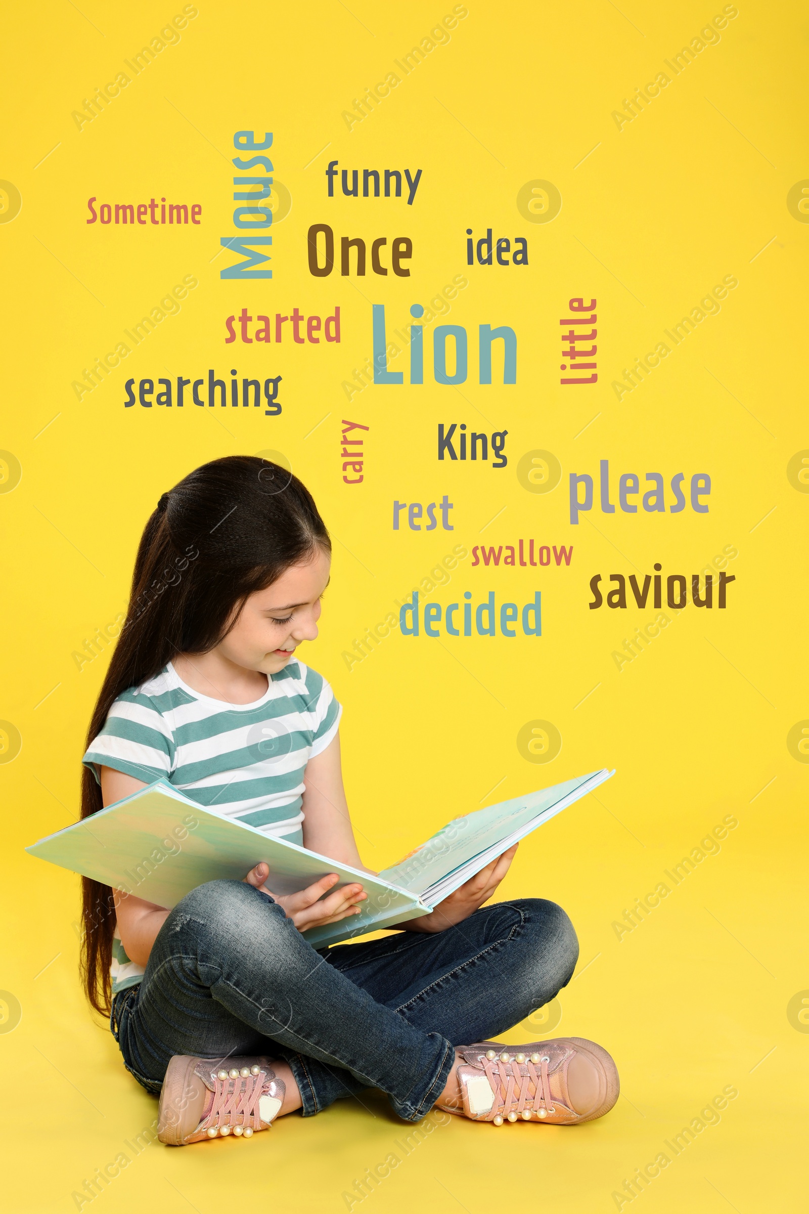 Image of Cute little girl reading book on yellow background with word cloud