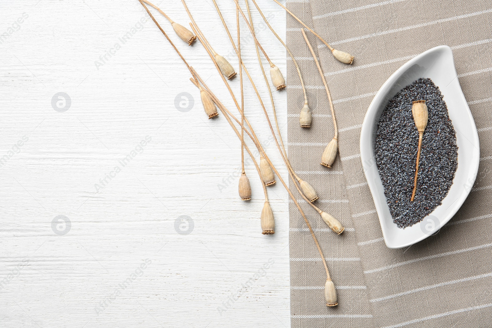 Photo of Flat lay composition with poppy seeds on wooden background