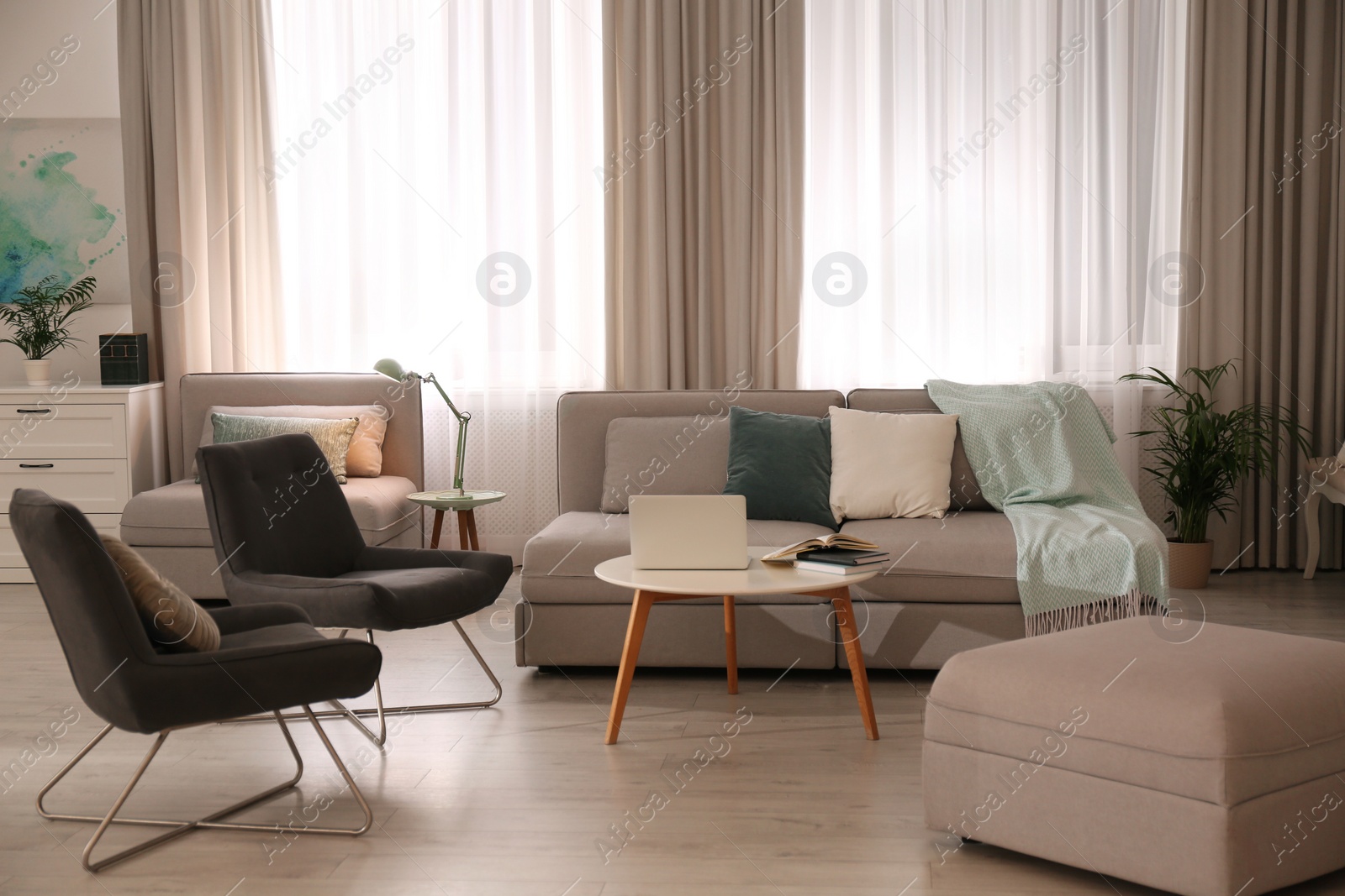 Photo of Stylish living room interior with comfortable sofa